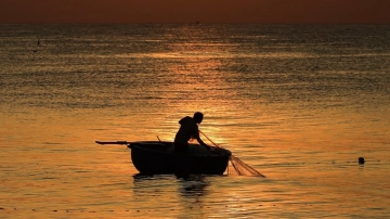 Coracle Boat Fisherman