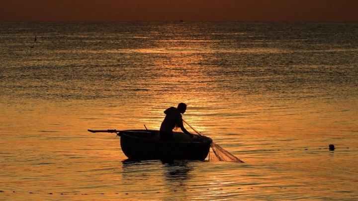 Coracle Boat Fisherman